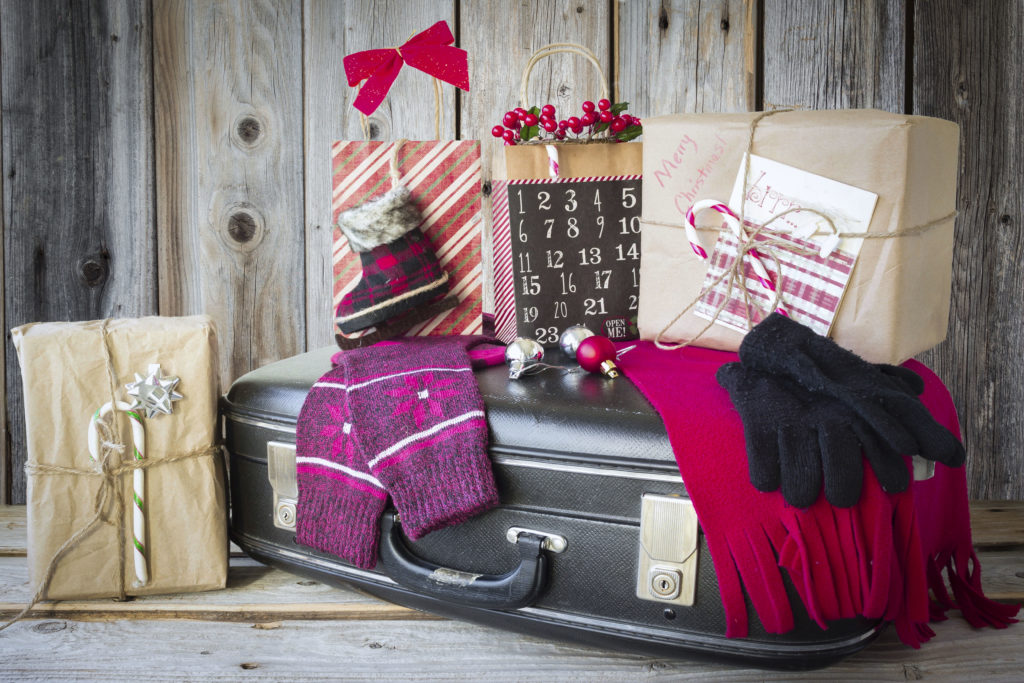 Christmas gifts on a suitcase