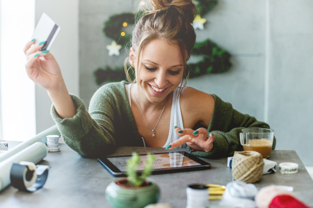 Woman shopping on her tablet at Christmas